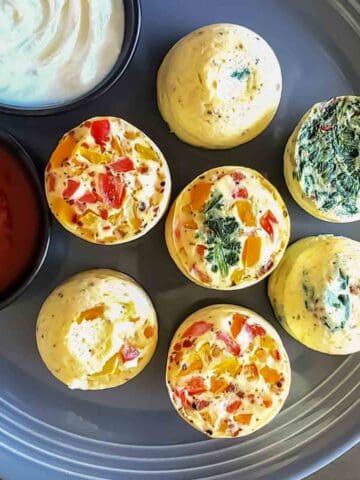 Air fryer egg bites with cottage cheese served with dipping sauce.