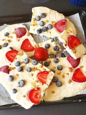 Frozen yogurt bark made with berries and granola.