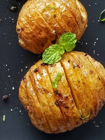 Crispy roasted hasselback potatoes served for dinner.