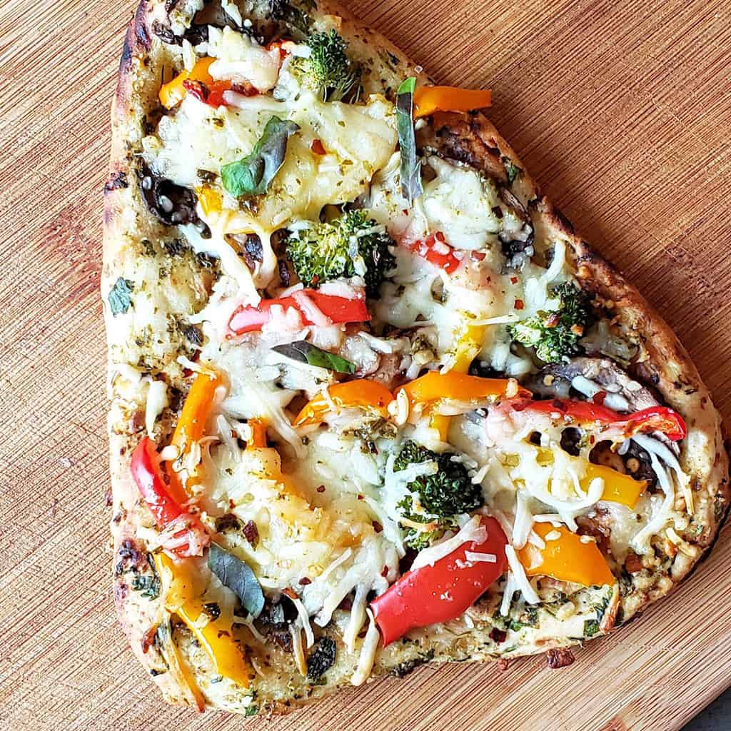 Pesto Naan Pizza with cheese and vegetables.