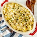 Instant Pot Creamed corn with cream cheese served for dinner with toppings and garnishes.