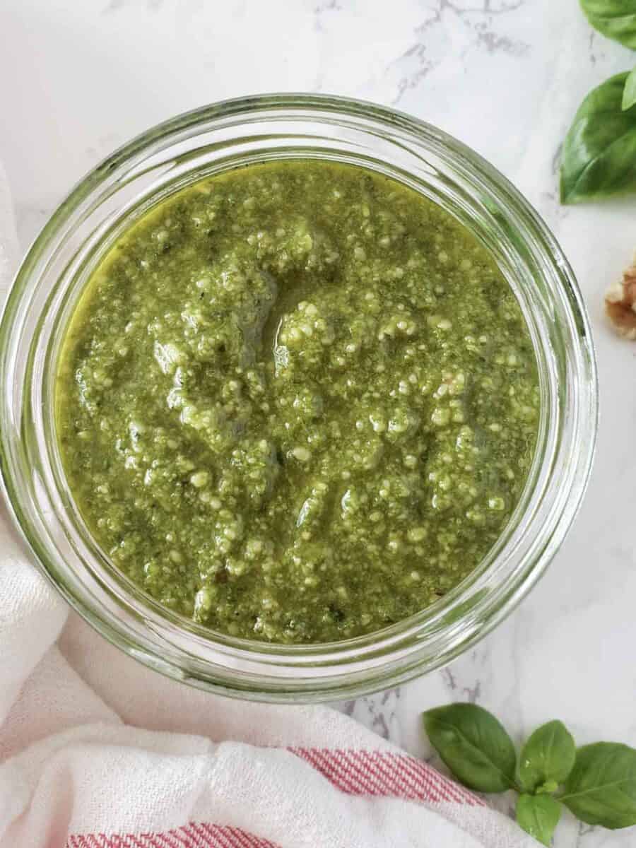 Homemade basil pesto without ine nuts with basil and walnuts.