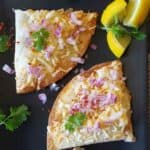 Pav Bhaji Quesadillas made by adding Indian street food pav bhaji in cheese quesadillas , served with chopped cilantro, onion and lemon wedges.