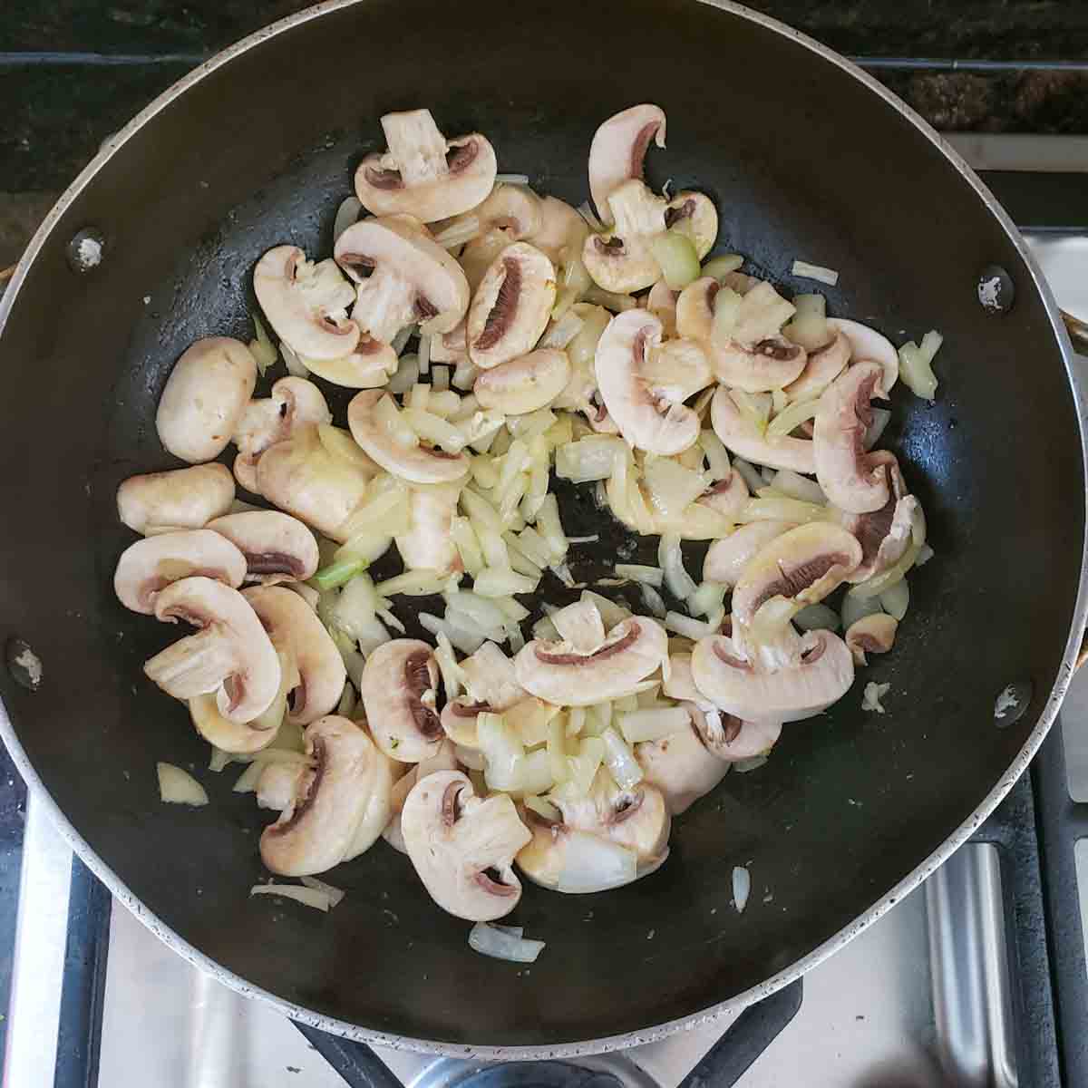 Process step two in making Asparagus Mushroom and Cheese Tart with Puff Pastry.