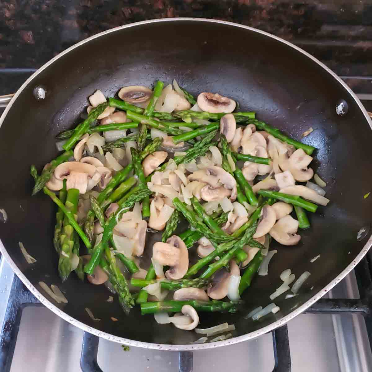 Process step three in making Asparagus Mushroom and Cheese Tart with Puff Pastry.