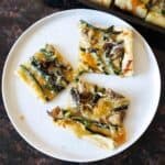 Asparagus Puff Pastry with mushrooms and cheese. This asparagus puff pastry tart is served for elegant brunch.