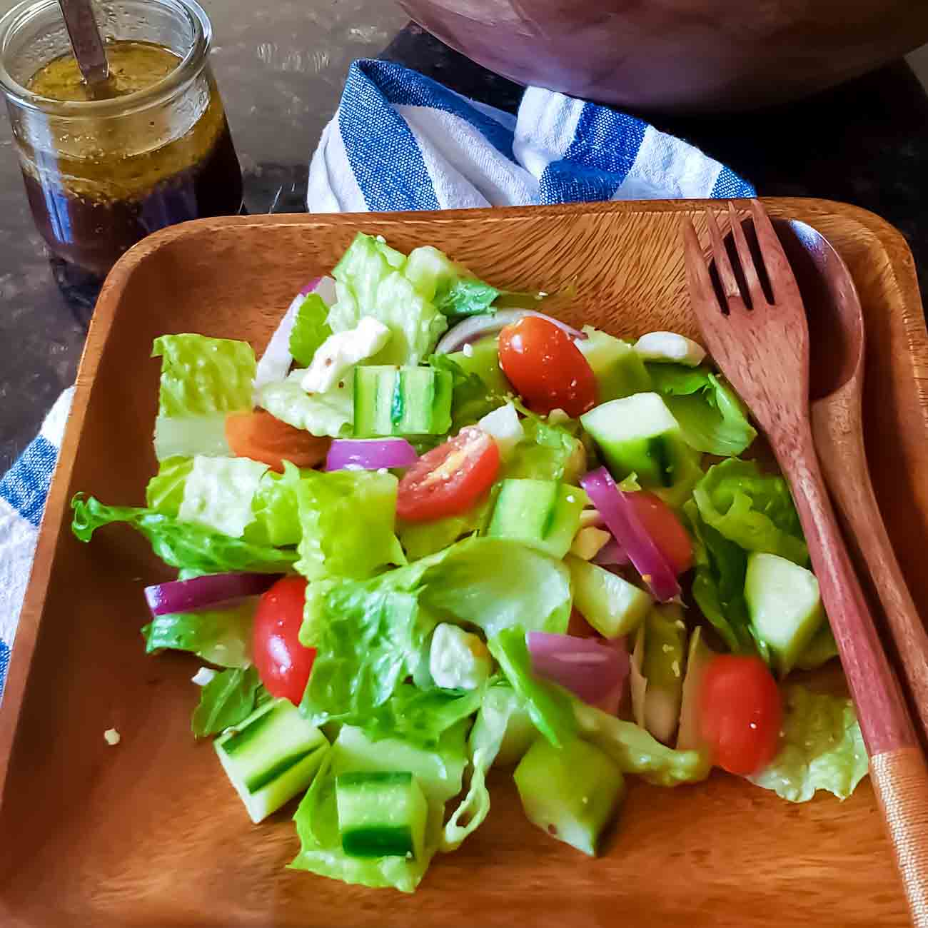 House salad with maple balsamic dressing served.