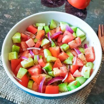 Balsamic Cucumber Tomato Salad served in a bowl.