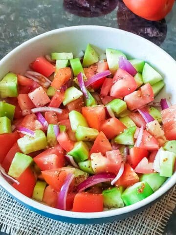 Balsamic Cucumber Tomato Salad served in a bowl.