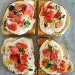 Colorful bruschetta crostini with cottage cheese dip.
