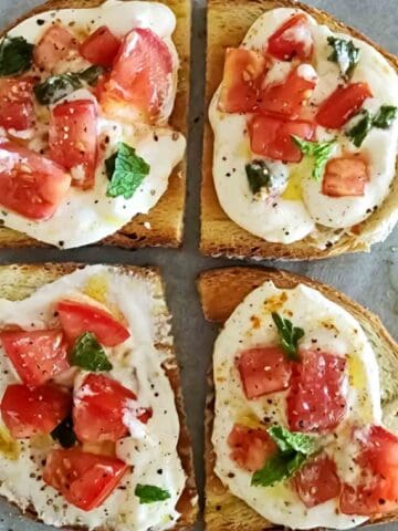 Colorful bruschetta crostini with cottage cheese dip.