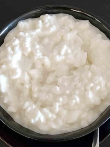 Creamy curdled cottage cheese in a bowl for healthy snacking.