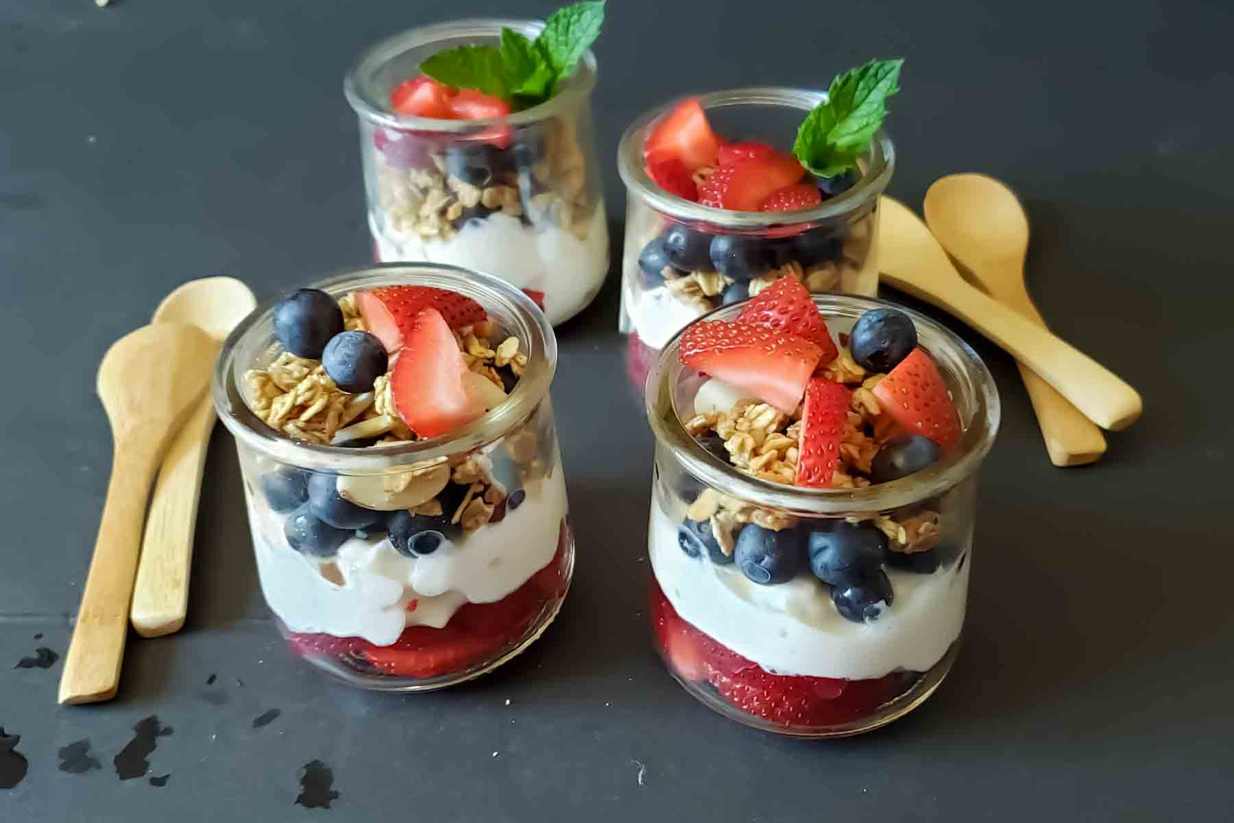 Breakfast cups filled with cottage cheese, fruit and granola.