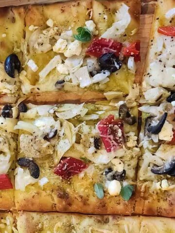 Freshly baked semi-homemade Greek Pizza served for dinner.