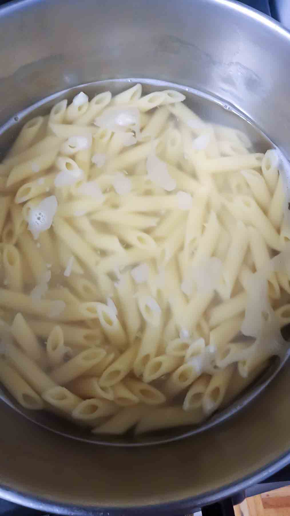 Penne Pasta Cooked in boiling water along with salt and olive oil.