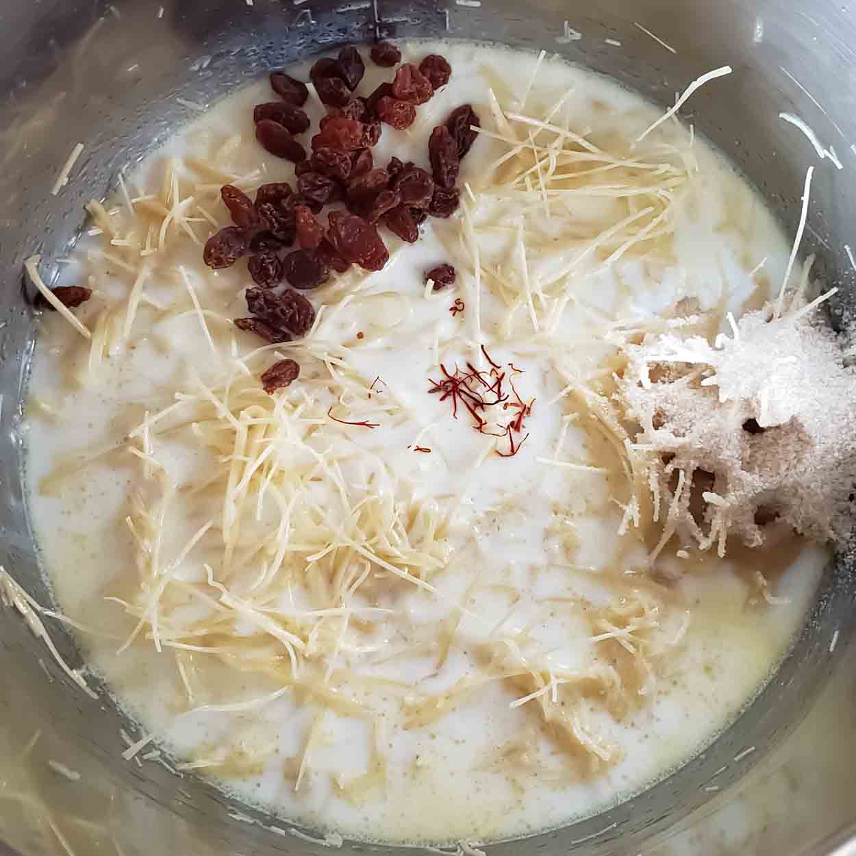 Adding all the ingredients to make the Easy Kheer Recipe for Diwali Desserts.