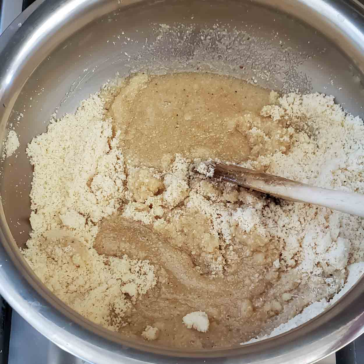 Mix Sugar syrup and roasted almond flour.