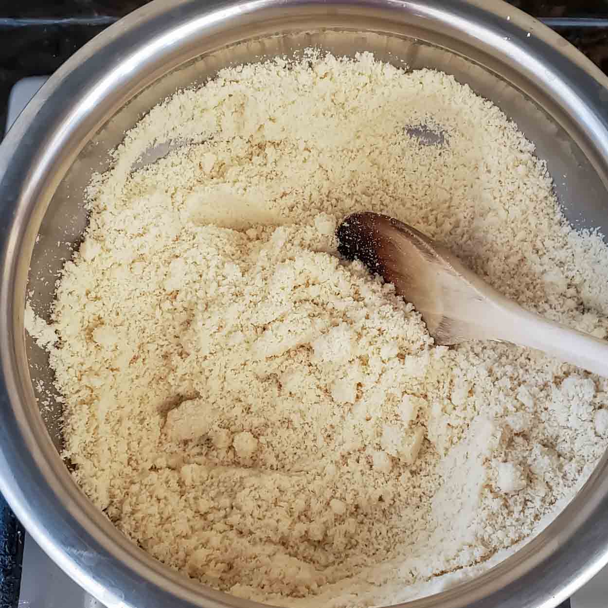 Roasting almond flour in a heavy bottom pan.