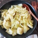 A bowl full of Irish braised cabbage also known as buttered cabbage made in Instant Pot.