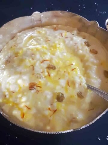 Coconut milk kheer is a rich, creamy, and naturally dairy-free Indian rice pudding made by simmering rice with coconut milk, sugar, and aromatic spices.