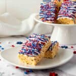 A tray full of red, white and blue rice krispie treat bars served for holiday celebrations.