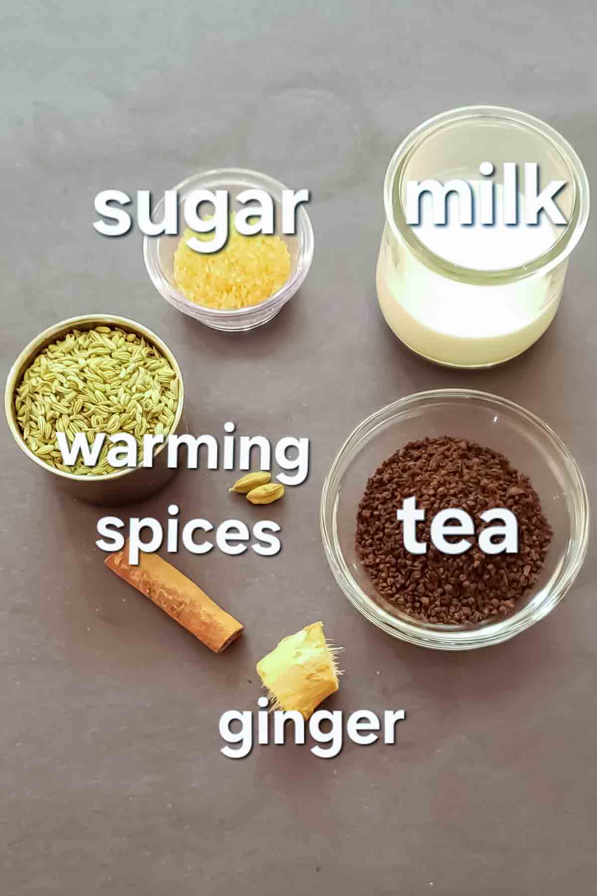 Chai tea ingredients displayed on the counter to make a cup of spiced Indian tea at home.