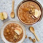 Apple pie oatmeal made with wholesome clean ingredients served with toppings for nourishing breakfast.