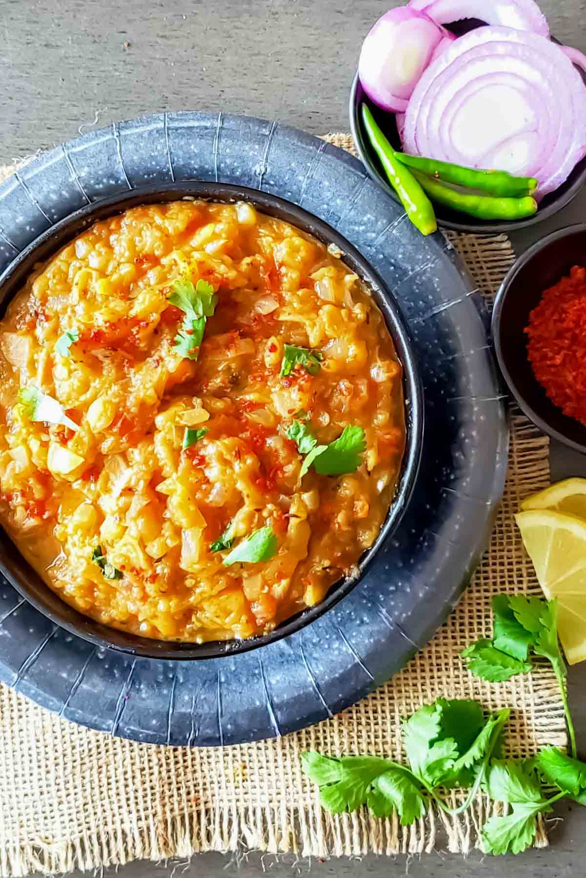 Vegan baingan bharta made in air fryer served with garnishes as Indian dinner.