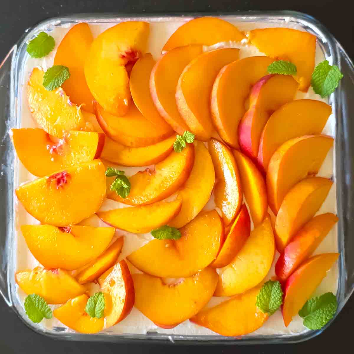 Summer peach cheesecake made with cream cheese and ripe peaches.