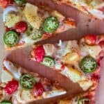 Sweet and spicy pineapple jalapeño pizza on flatbread served for an easy weeknight dinner.