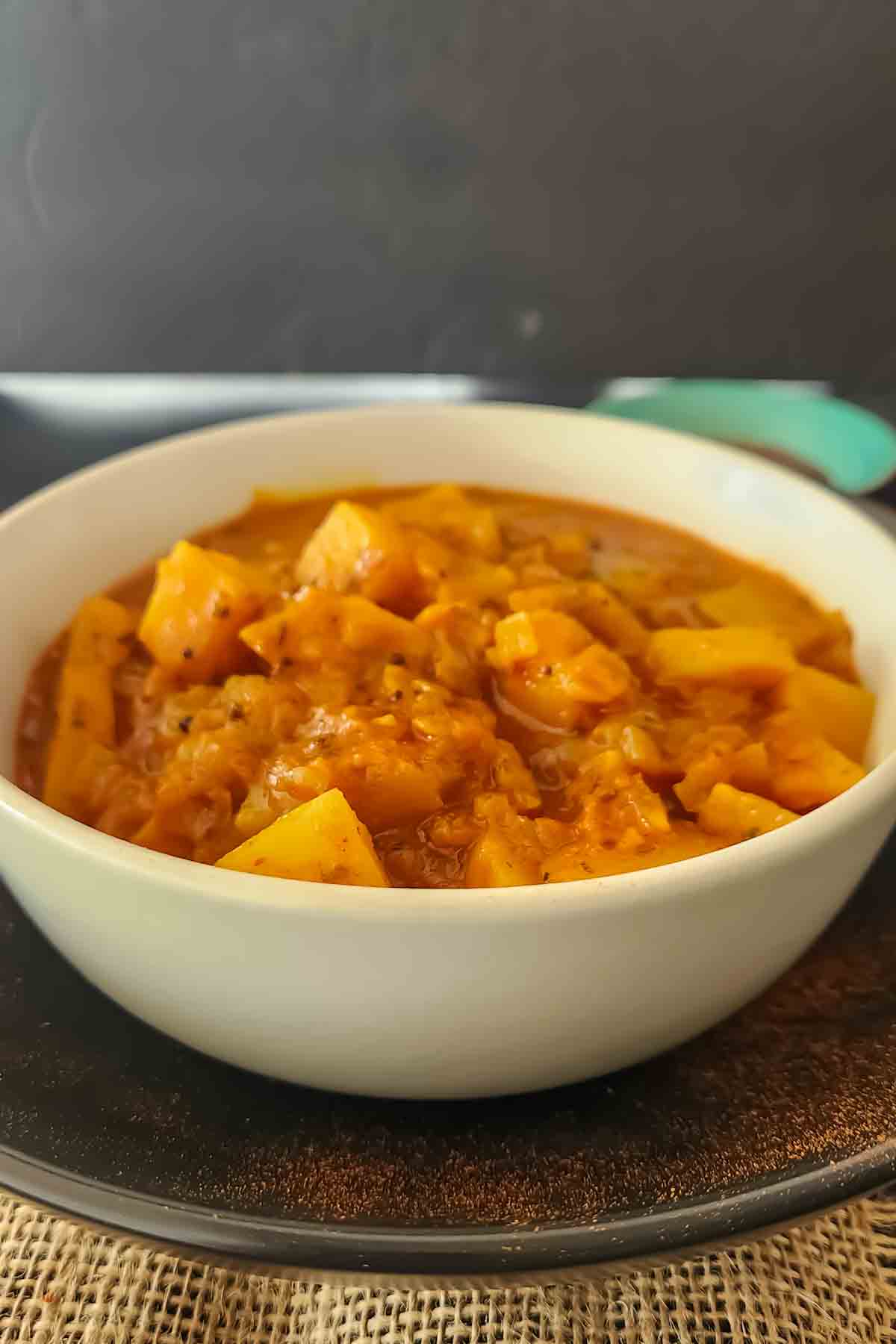 Bowl of gluten-free Goan vegetable vindaloo served for dinner.