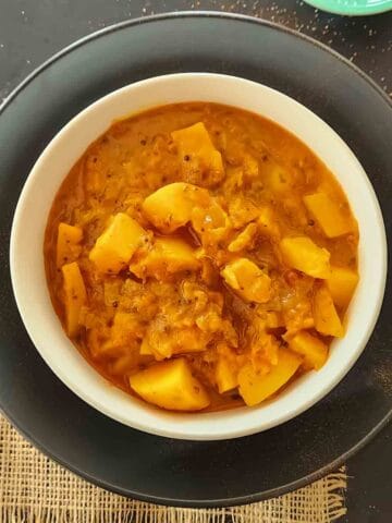 Vindaloo which is Goan Spicy curry made with potatoes and spicy tomato based sauce served for 20-minute curry dinner.