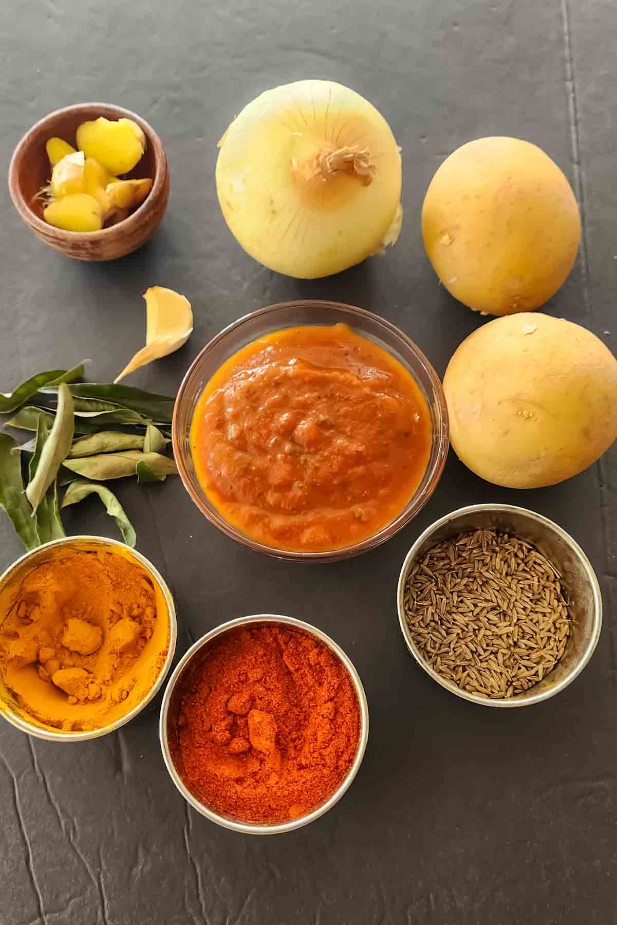 Vegan and gluten-free ingredients used in making Aloo Vindaloo Recipe.
