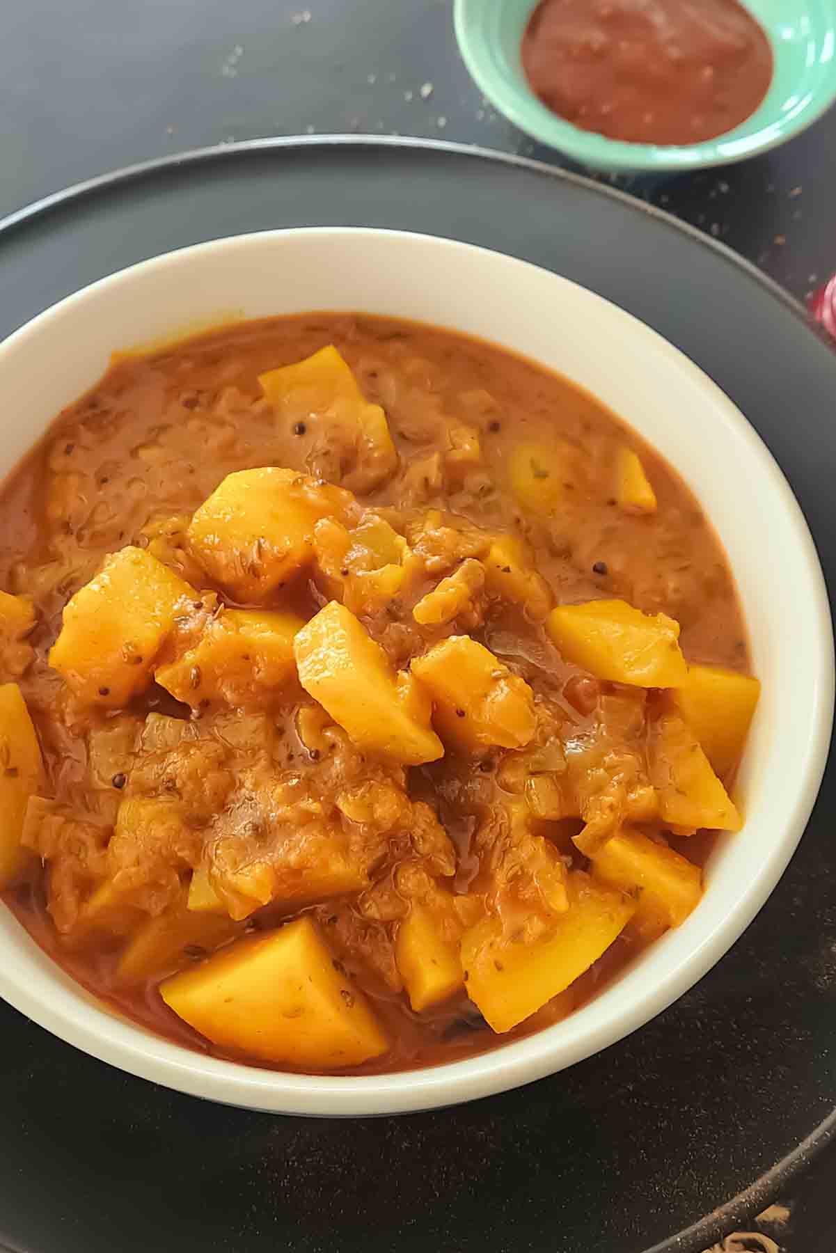 Instant Pot vindaloo made with  potatoes and vegetables in a spicy and tangy Goan curry sauce.