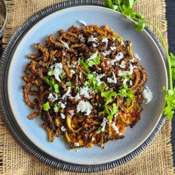 Air fryer bitter gourd recipe with crispy karela slices. This vegan and gluten-free karela fry is everyday Indian meal.