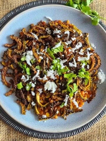 Air fryer bitter gourd recipe with crispy karela slices. This vegan and gluten-free karela fry is everyday Indian meal.