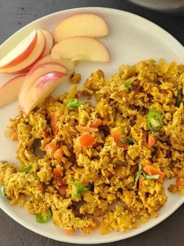 Homemade Anda Bhurji with soft scrambled eggs, tomato, onion, and green chilies. Egg bhurji is Indian Spiced Scrambled Eggs served for protein rich vegetarian breakfast.