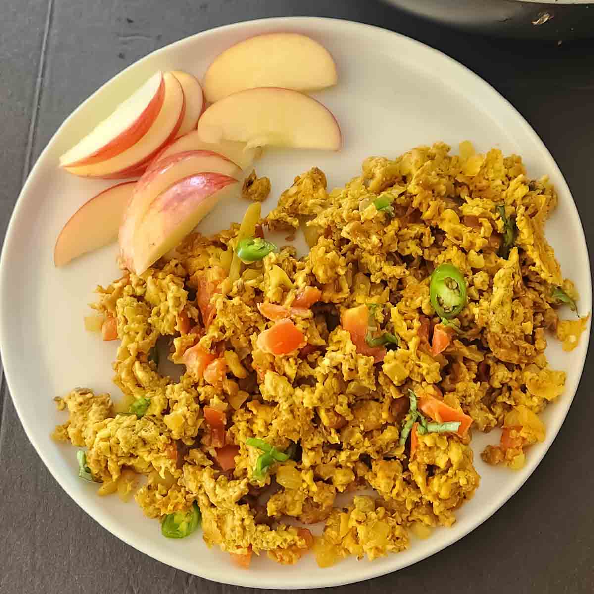 Homemade Anda Bhurji with soft scrambled eggs, tomato, onion, and green chilies. Egg bhurji is Indian Spiced Scrambled Eggs served for protein rich vegetarian breakfast.