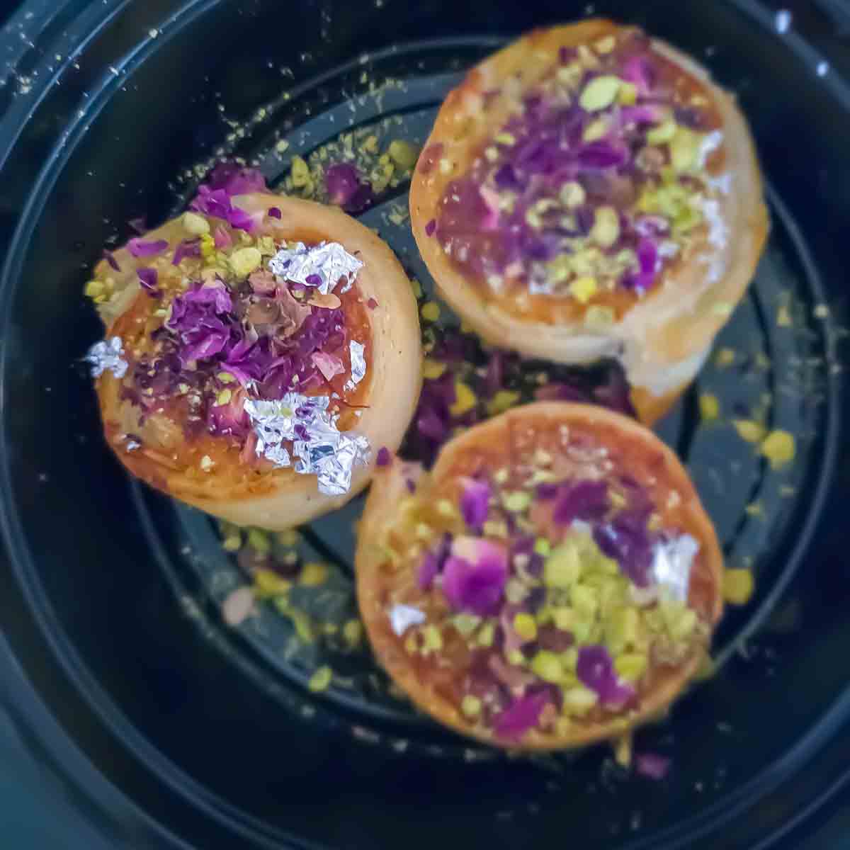 Easy Gujiya Bites made using store bought puff pastry. These gujiya bites have the same flavor of a traditional gujiya but are so much easier to make!