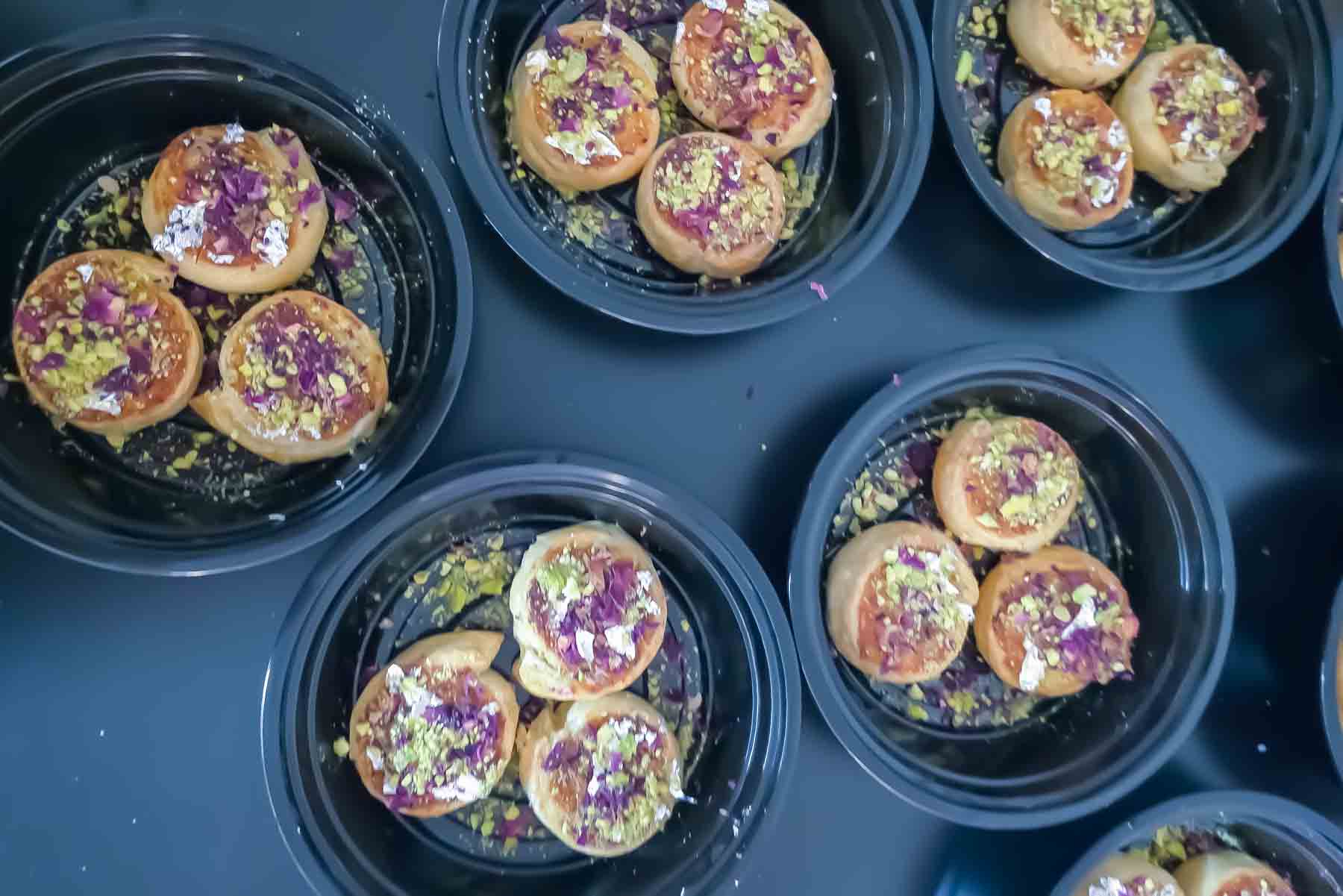 A tray full of Puff Pastry Gujiya Bites  garnished with festive items.