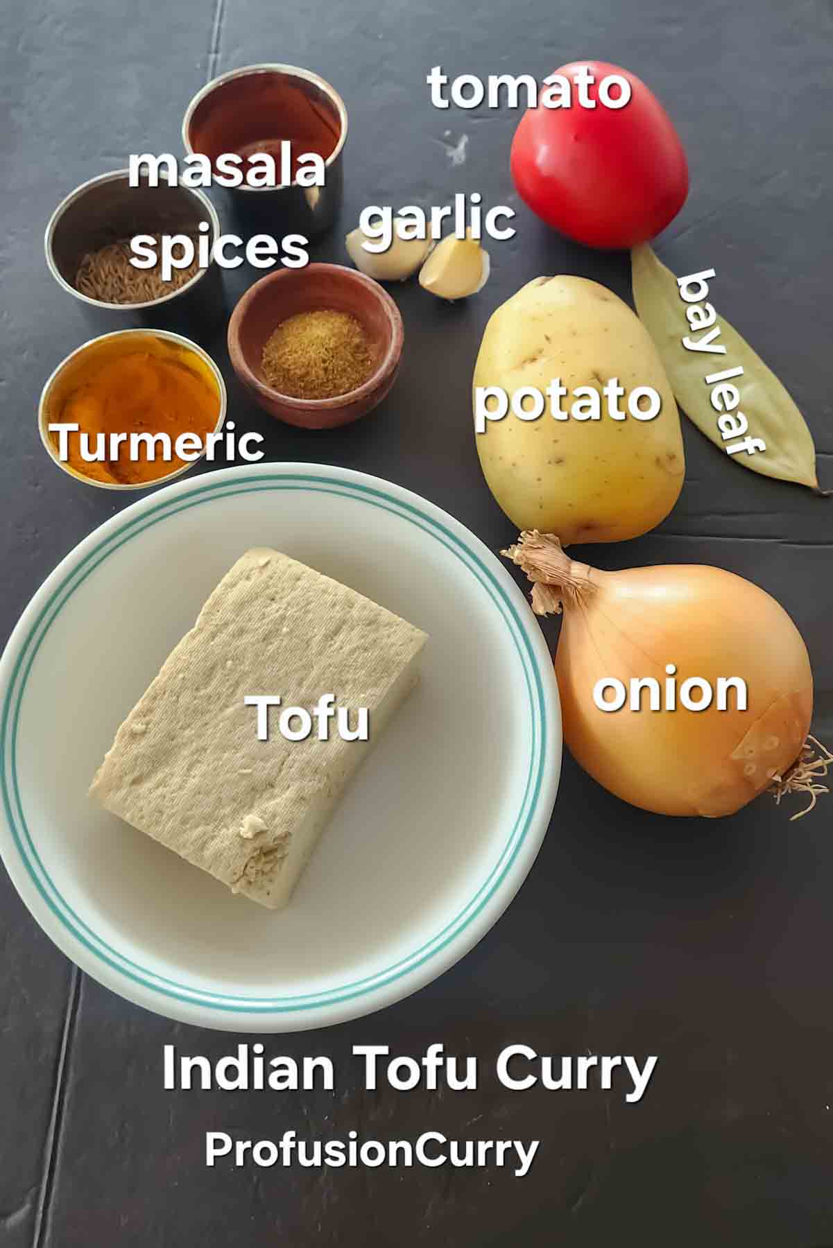 Ingredients used in making tofu curry recipe with Indian spices and vegetables.