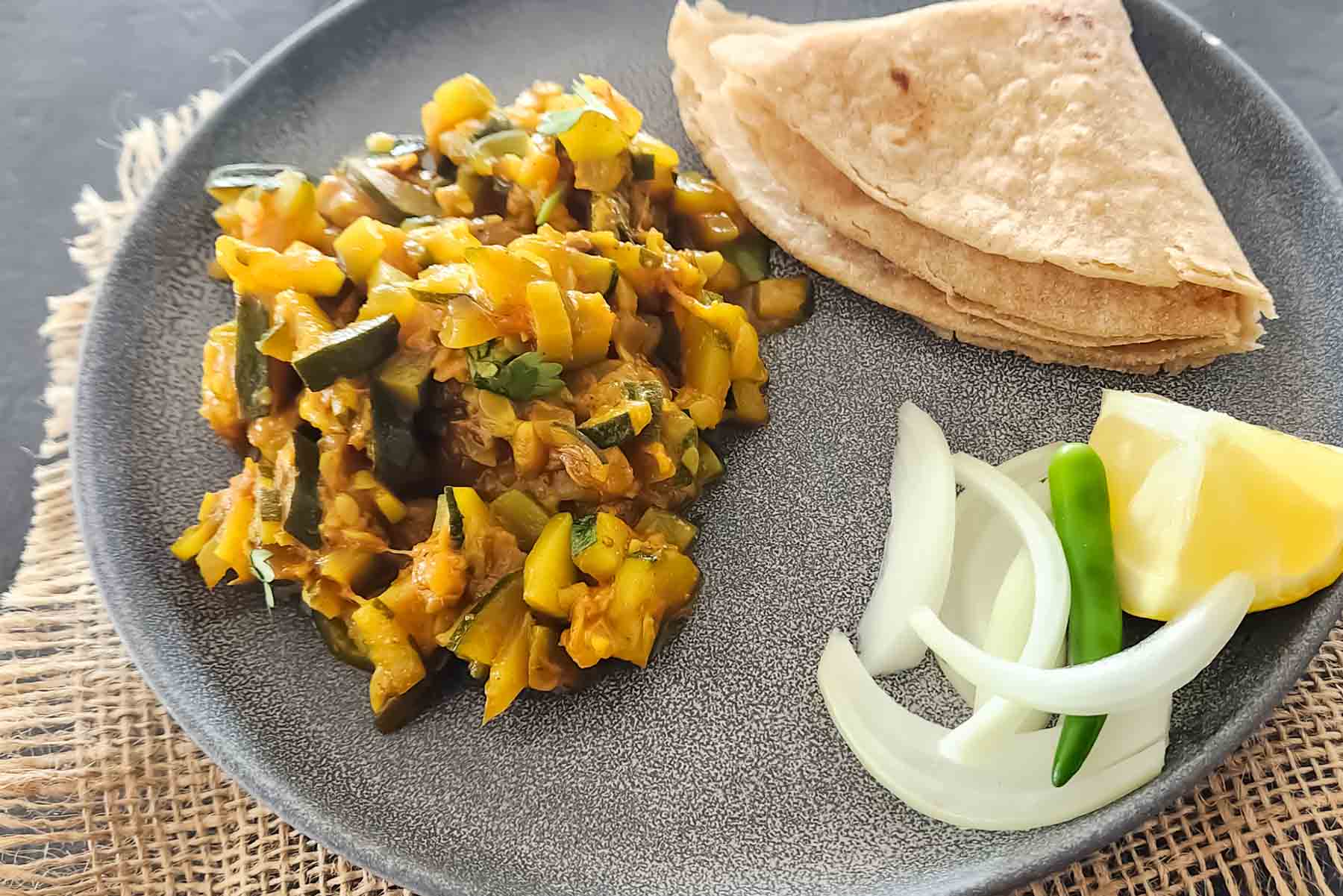 Homemade courgette curry in a skillet.