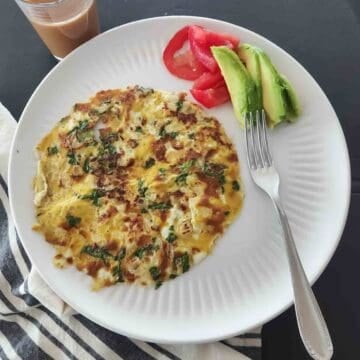 This easy Masala Omelette is a flavorful, high-protein Indian breakfast made with eggs, onions, green chili, cilantro, garam masala, and red chili powder. Ready in about 10 minutes!