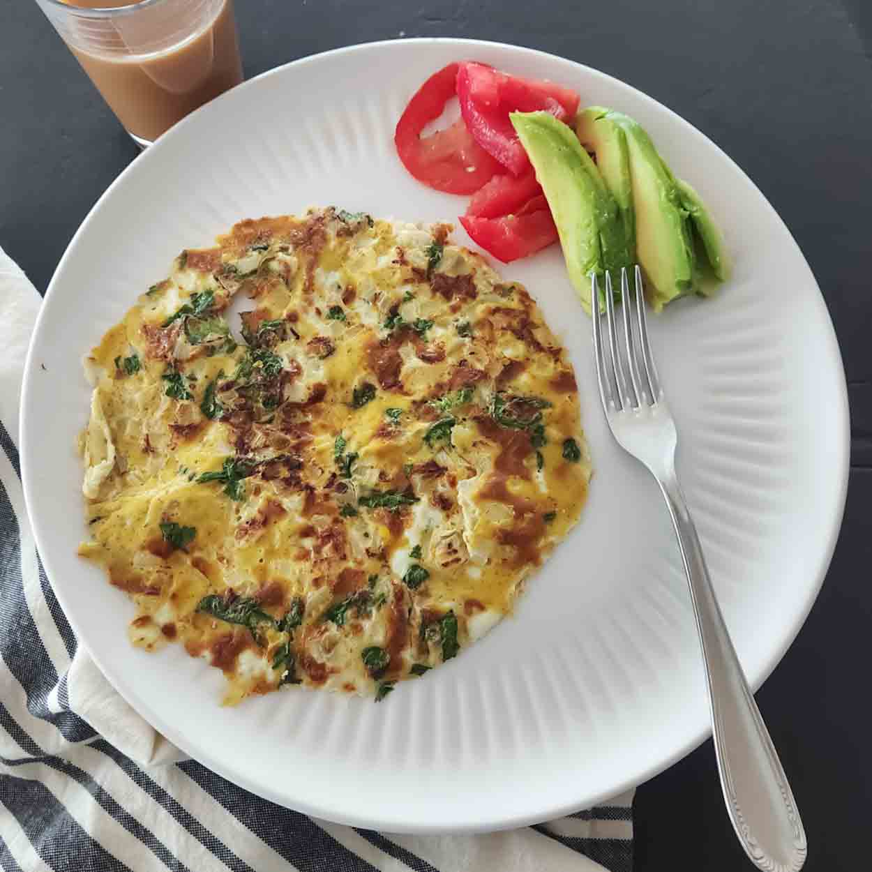 This easy Masala Omelette is a flavorful, high-protein Indian breakfast made with eggs, onions, green chili, cilantro, garam masala, and red chili powder. Ready in about 10 minutes!