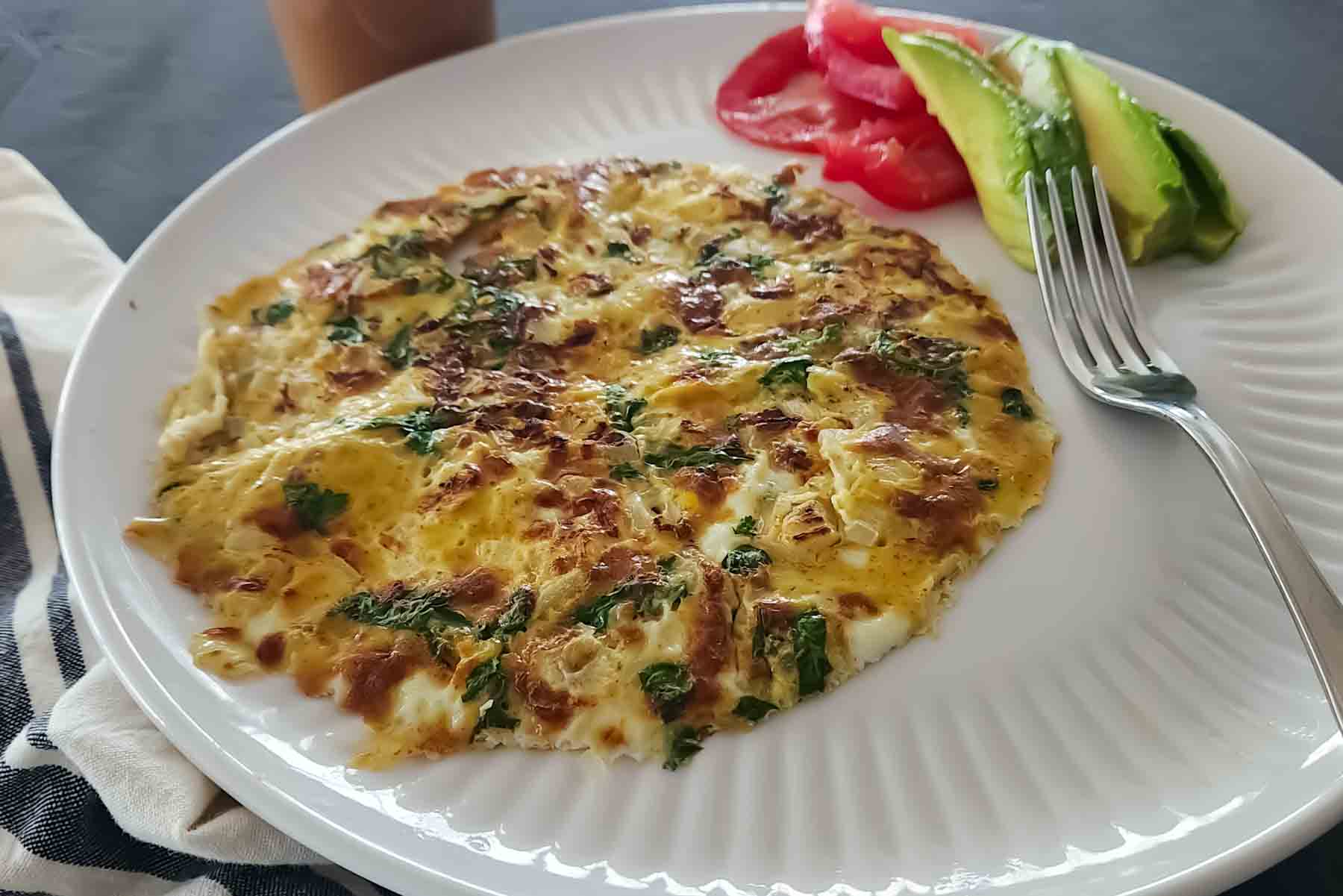 Spicy masala omelet with cilantro and onions.