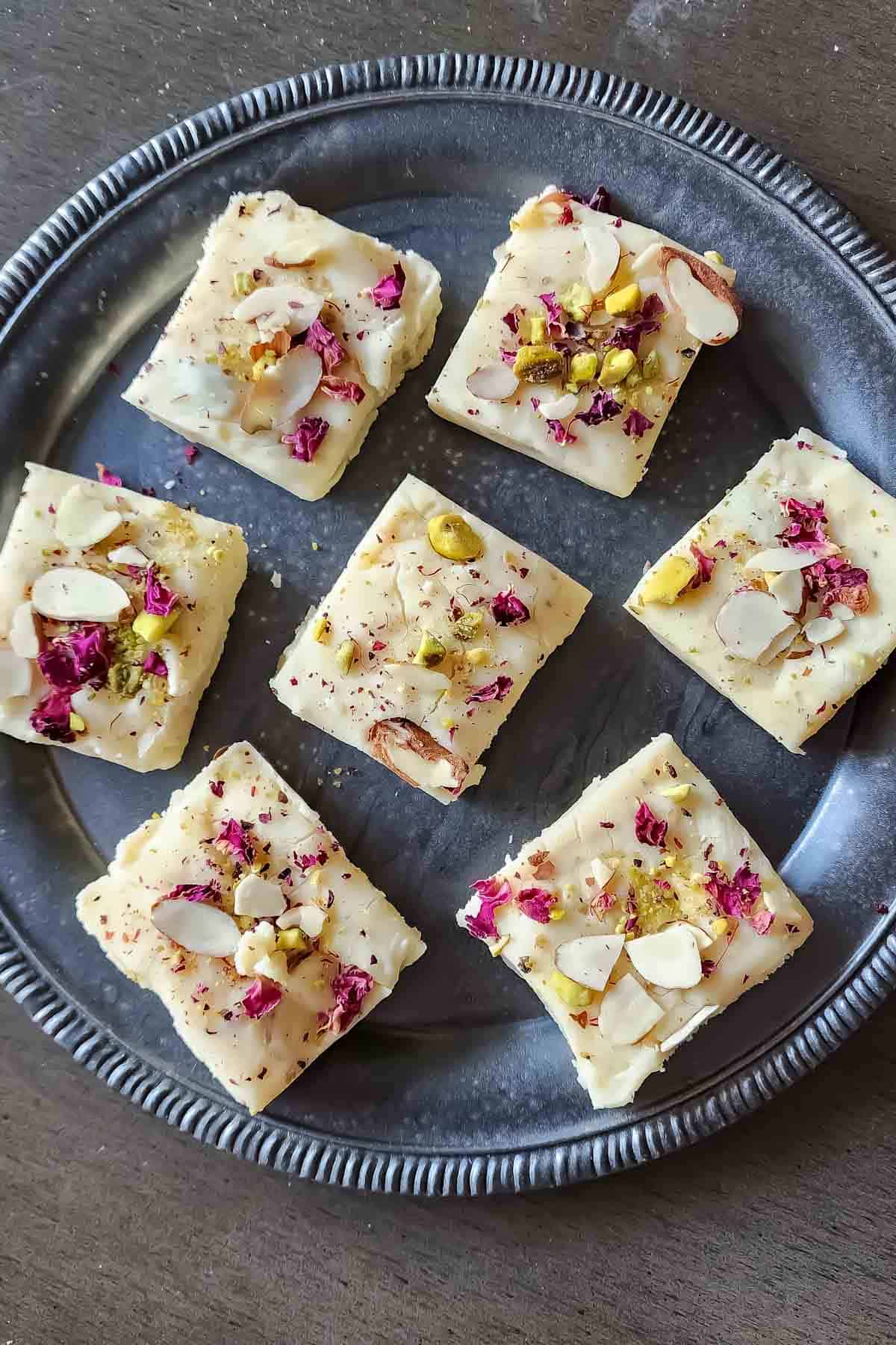 Saffron cardamom white chocolate fudge topped with pistachios.
