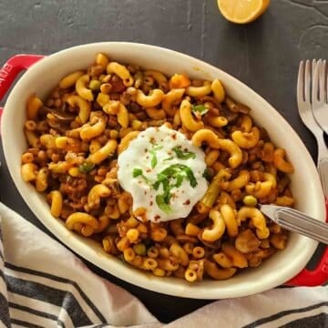 Easy vegan American goulash made with lentils, mushrooms, pasta, and tomato sauce for one pot comfort food.