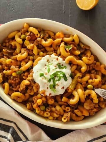 Easy vegan American goulash made with lentils, mushrooms, pasta, and tomato sauce for one pot comfort food.