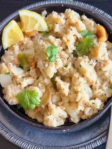 Homemade vegetable suji upma served for an Indian breakfast. suji upma, rava upma, sooji upma, semolina upma, Indian spiced cream of wheat, South Indian breakfast, easy Indian breakfast, and vegetable upma.