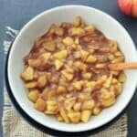 Homemade apple pie filling which is cinnamon apples made with fresh apple slices, sugar, and cinnamon for an easy breakfast topping.